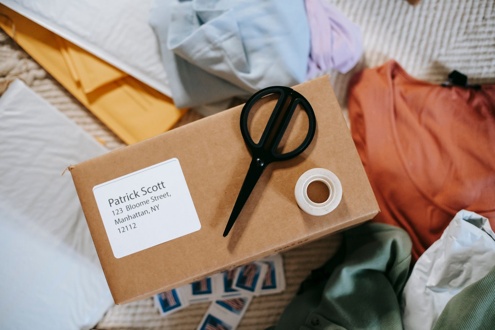 Sample parcel with address label, scissors and tape