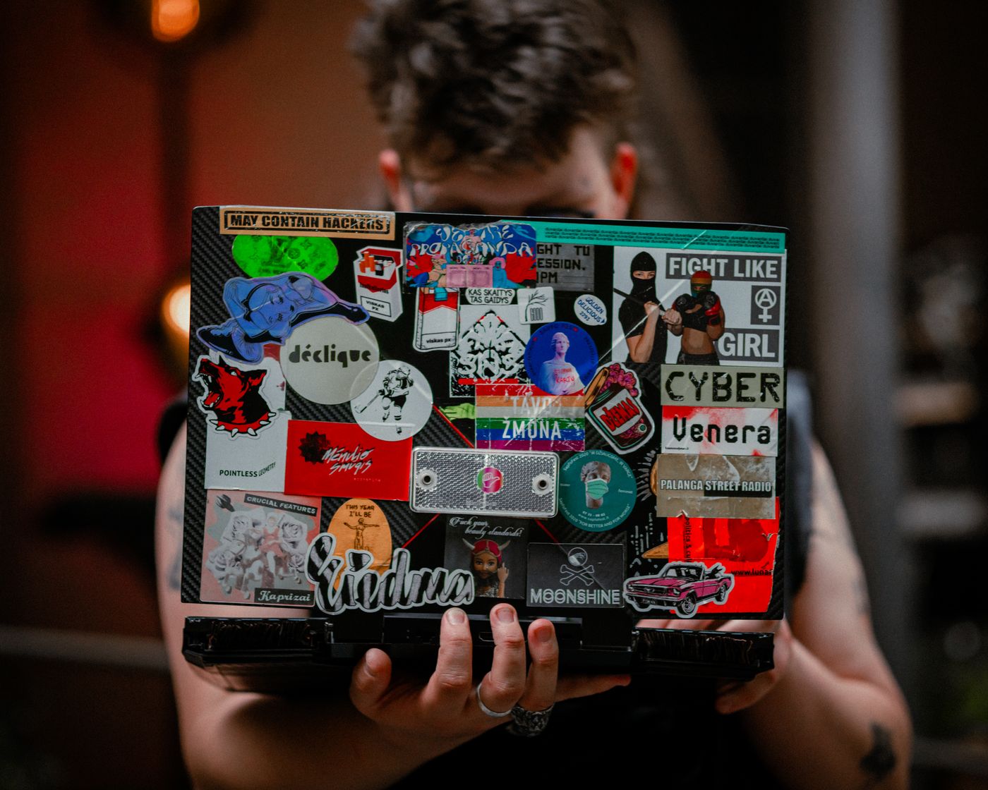 Laptop covered with printed vinyl stickers